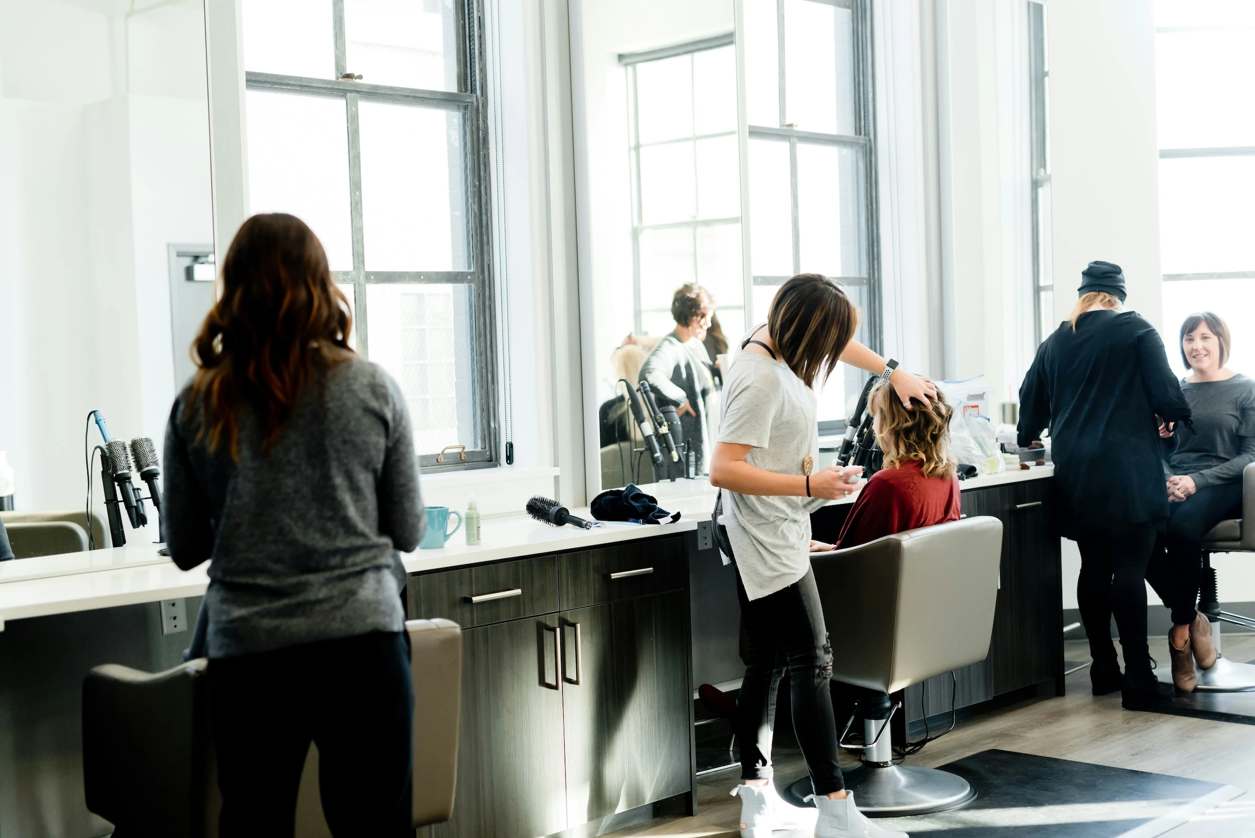 Salon worker providing haircut service